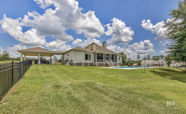 21151 Caveletti Cir, Fairhope, AL 36532 - rear view of house featuring a fenced backyard and a chimney