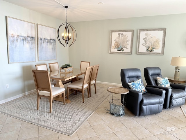 dining area featuring baseboards, a chandelier, and light tile patterned flooring