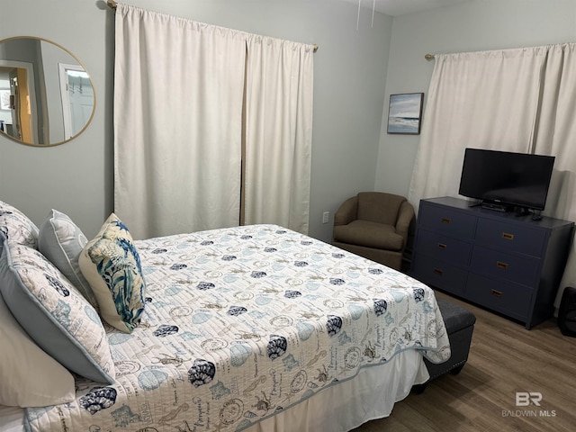 bedroom featuring wood finished floors