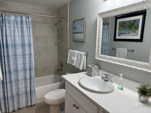 full bathroom featuring tile patterned flooring, toilet, shower / bath combo with shower curtain, and vanity