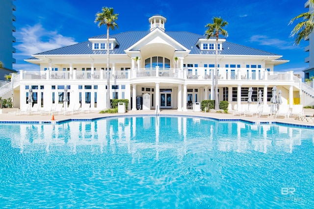 community pool with a patio area