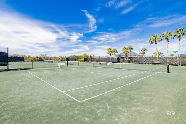 view of tennis court with fence