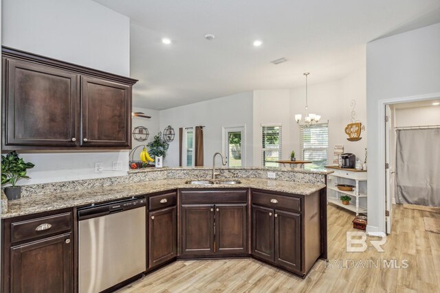 kitchen with a chandelier, sink, kitchen peninsula, light hardwood / wood-style flooring, and stainless steel dishwasher