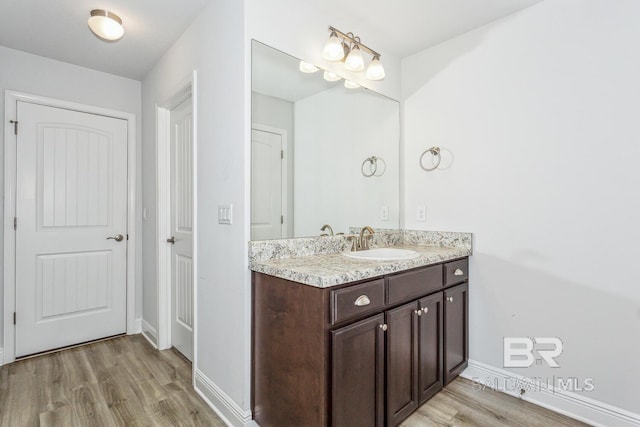 bathroom featuring vanity and hardwood / wood-style floors