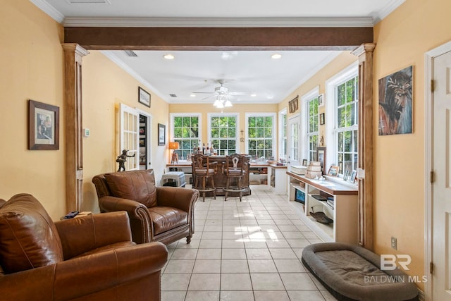 living room featuring ceiling fan, crown molding, plenty of natural light, and light tile patterned floors