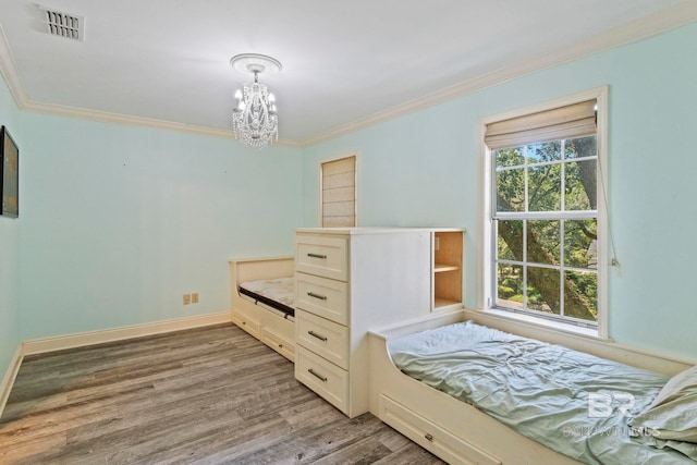 unfurnished bedroom featuring wood-type flooring and crown molding