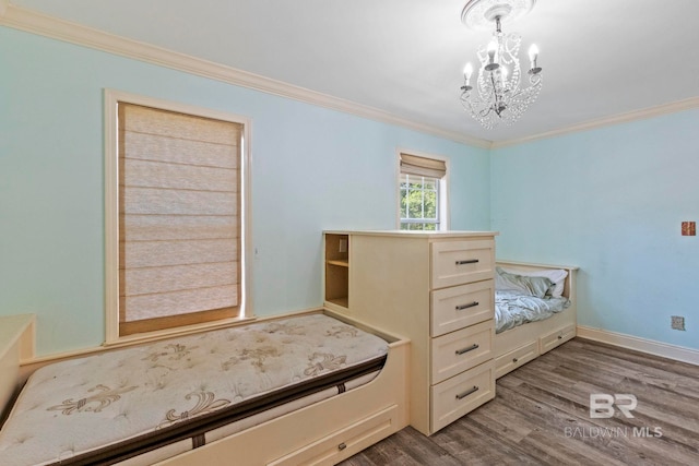 bedroom featuring crown molding, dark wood-type flooring, and an inviting chandelier