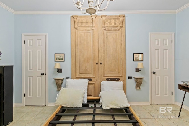 interior space featuring an inviting chandelier, crown molding, and light tile patterned floors