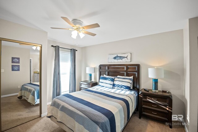 bedroom featuring ceiling fan, baseboards, and carpet flooring