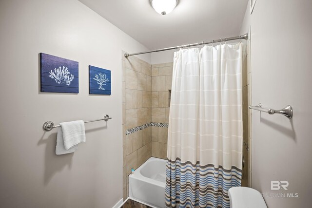 bathroom featuring shower / bath combination with curtain