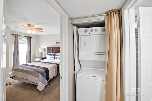 carpeted bedroom with stacked washing maching and dryer and ceiling fan