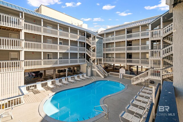 community pool with a patio area