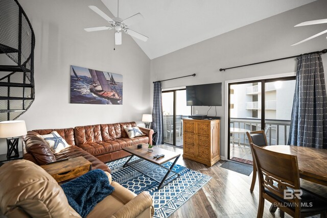 living room with high vaulted ceiling, ceiling fan, and wood finished floors