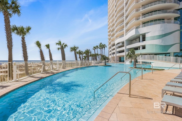 view of swimming pool with a patio