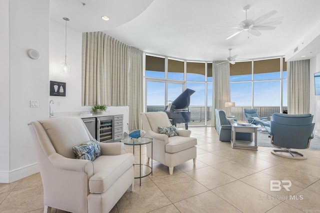 26302 Perdido Beach Blvd Unit D2301, Orange Beach, AL 36561 - living area featuring wine cooler, light tile patterned floors, a wall of windows, ceiling fan, and bar