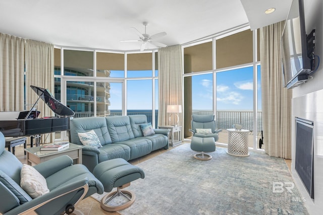 26302 Perdido Beach Blvd Unit D2301, Orange Beach, AL 36561 - living area featuring a ceiling fan, a towering ceiling, and a wall of windows