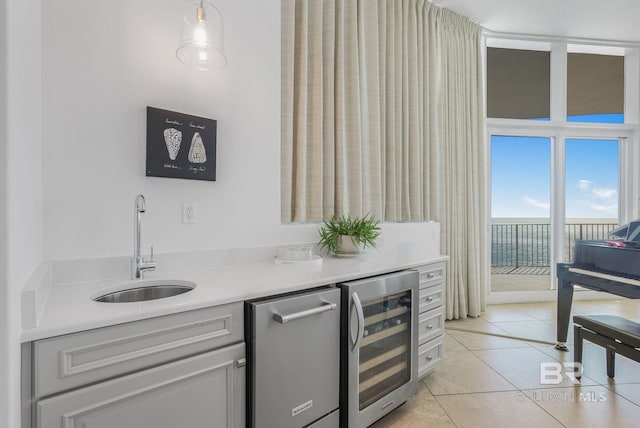 26302 Perdido Beach Blvd Unit D2301, Orange Beach, AL 36561 - bar with a sink, indoor wet bar, decorative light fixtures, beverage cooler, and light tile patterned floors