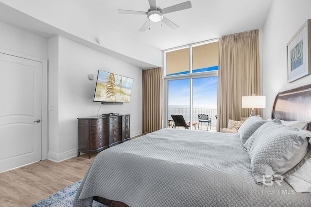 bedroom with access to exterior, light wood-type flooring, and ceiling fan