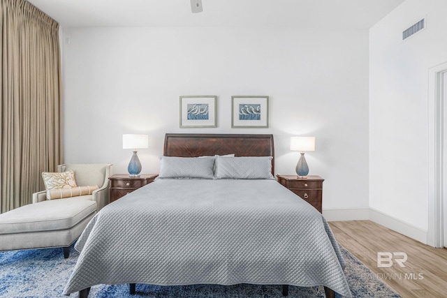 bedroom featuring hardwood / wood-style flooring and ceiling fan