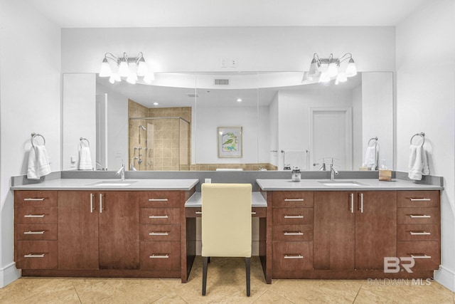 bathroom featuring vanity, walk in shower, and tile patterned flooring