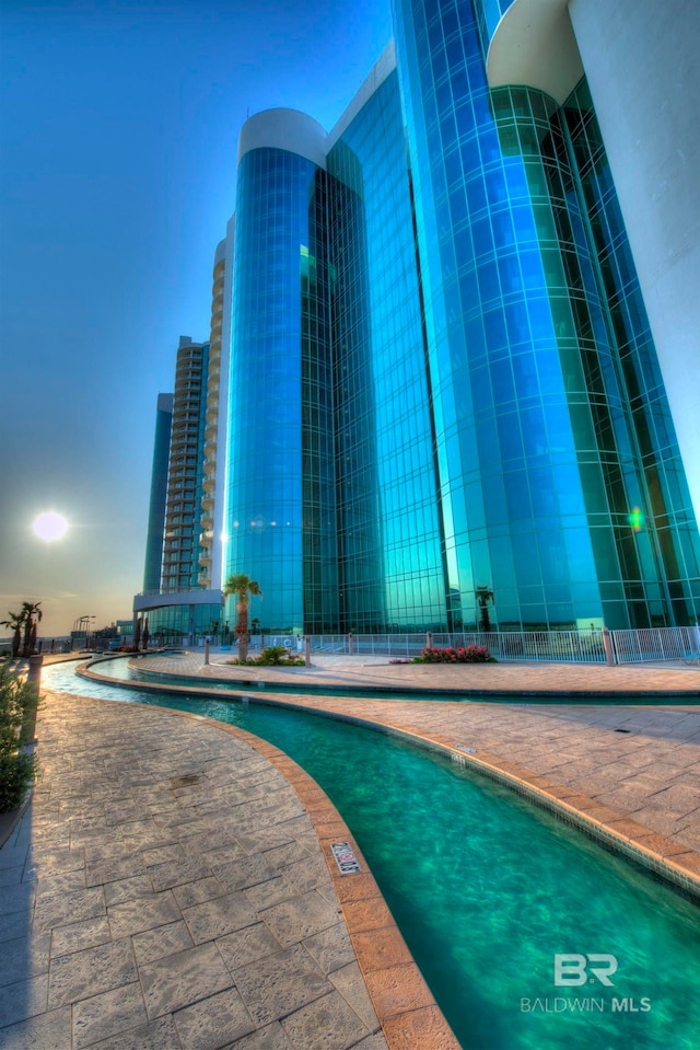 view of pool at dusk