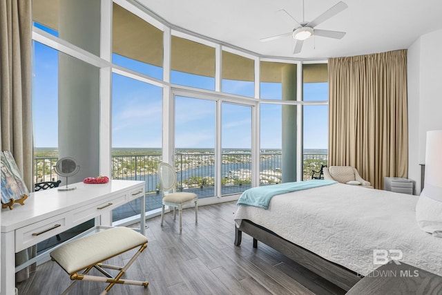 26302 Perdido Beach Blvd Unit D2301, Orange Beach, AL 36561 - bedroom with wood finished floors, floor to ceiling windows, and a water view