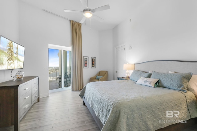 26302 Perdido Beach Blvd Unit D2301, Orange Beach, AL 36561 - bedroom with a high ceiling, light wood finished floors, a ceiling fan, and access to outside