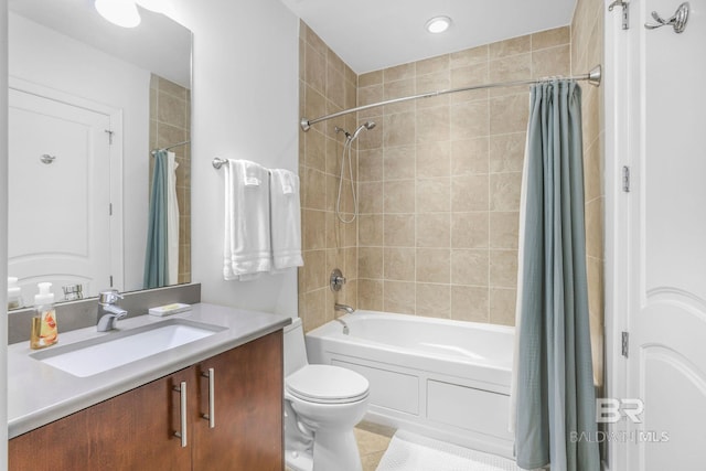 full bathroom featuring vanity, shower / tub combo with curtain, toilet, and tile patterned flooring