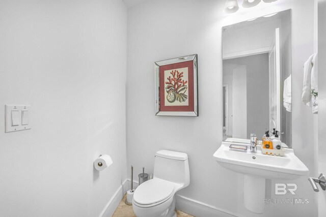 26302 Perdido Beach Blvd Unit D2301, Orange Beach, AL 36561 - half bath featuring baseboards and toilet