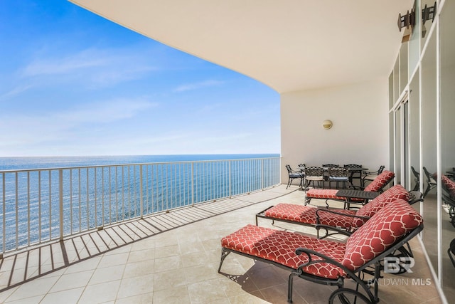 balcony featuring a water view