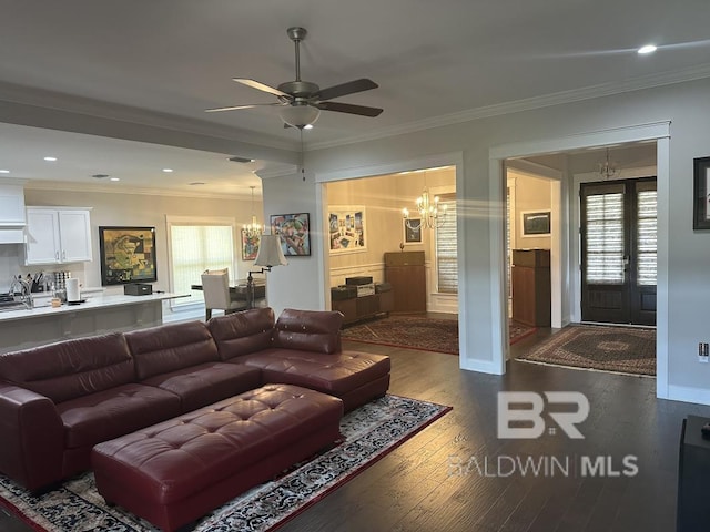 3872 Stafford Blvd, Gulf Shores, AL 36542 - living room featuring a chandelier, ornamental molding, wood finished floors, a ceiling fan, and recessed lighting