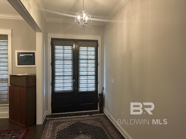 3872 Stafford Blvd, Gulf Shores, AL 36542 - doorway featuring french doors, crown molding, a chandelier, healthy amount of natural light, and dark wood finished floors