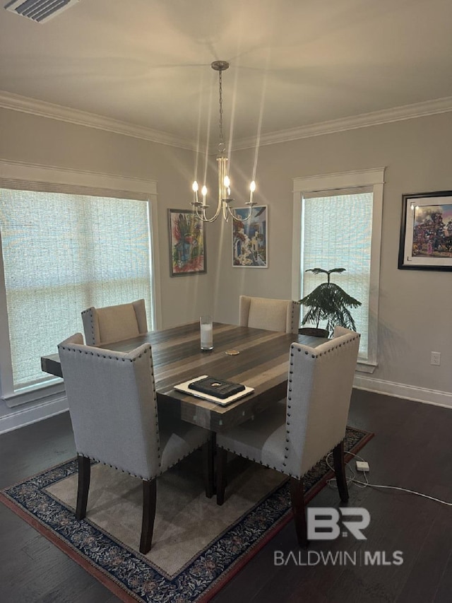 3872 Stafford Blvd, Gulf Shores, AL 36542 - dining space with a chandelier, crown molding, plenty of natural light, and dark wood-style flooring