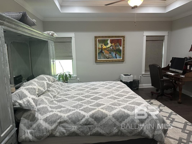 3872 Stafford Blvd, Gulf Shores, AL 36542 - bedroom with a raised ceiling, wood finished floors, and ornamental molding