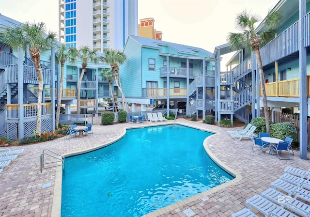 view of swimming pool featuring a patio area