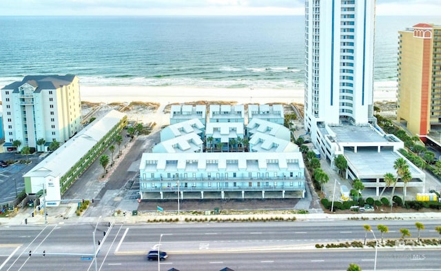 bird's eye view featuring a beach view and a water view