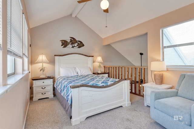 bedroom featuring lofted ceiling with beams, ceiling fan, and light carpet