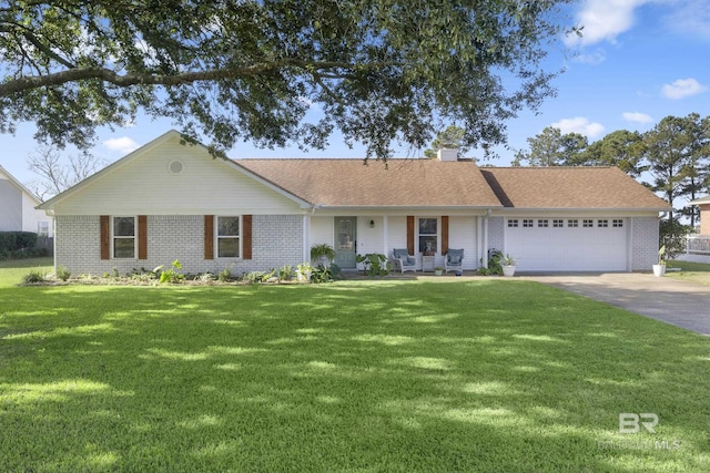 ranch-style home with a garage and a front lawn