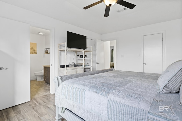 bedroom with ensuite bathroom and ceiling fan