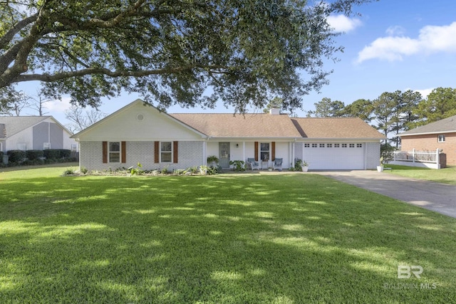 single story home with a garage and a front yard