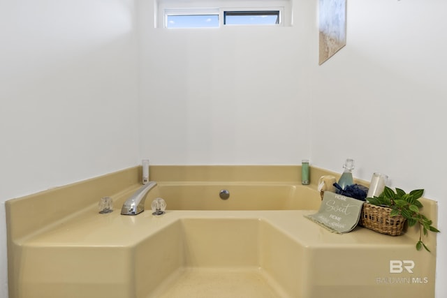 bathroom featuring a washtub