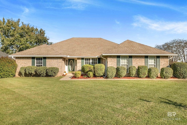 ranch-style house with a front lawn