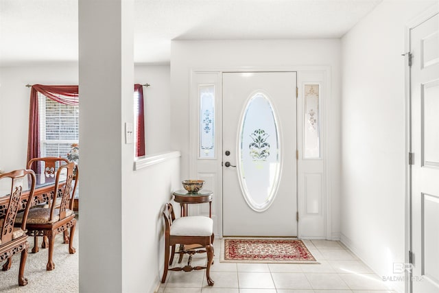 foyer with light tile patterned flooring