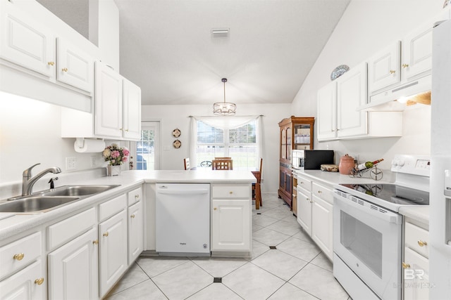 kitchen with kitchen peninsula, white cabinets, sink, decorative light fixtures, and white appliances