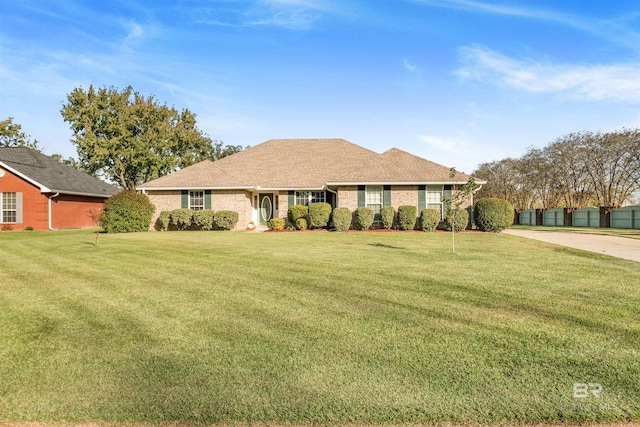 ranch-style house with a front lawn