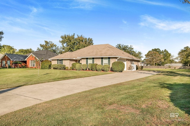 ranch-style home featuring a front yard and a garage