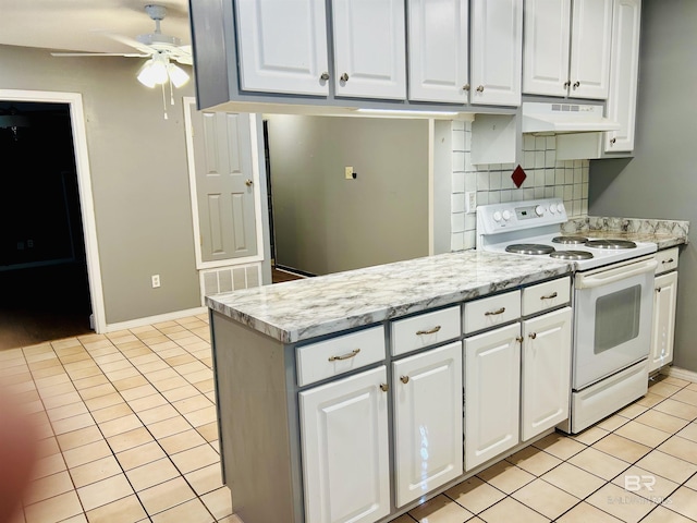 kitchen featuring white cabinetry, light tile patterned floors, and electric range