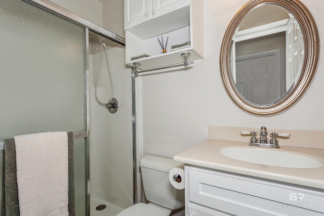 full bathroom featuring vanity, toilet, and a stall shower