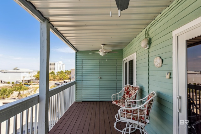 wooden terrace featuring a ceiling fan