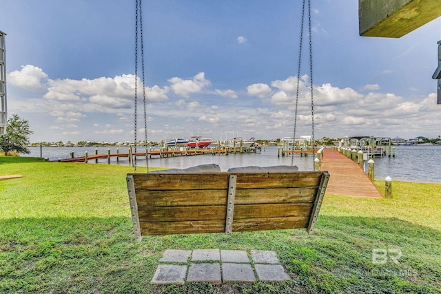 view of yard featuring a boat dock and a water view